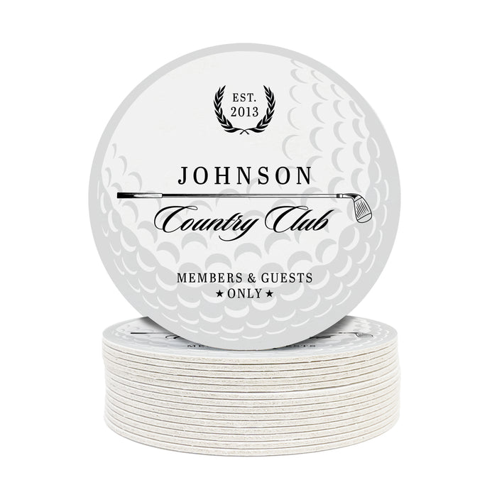 A stack of white coasters with black text and graphics on them, including text that reads "Est. 2013 Johnson Country Club MEMBERS & GUESTS ONLY" and a golf ball background.