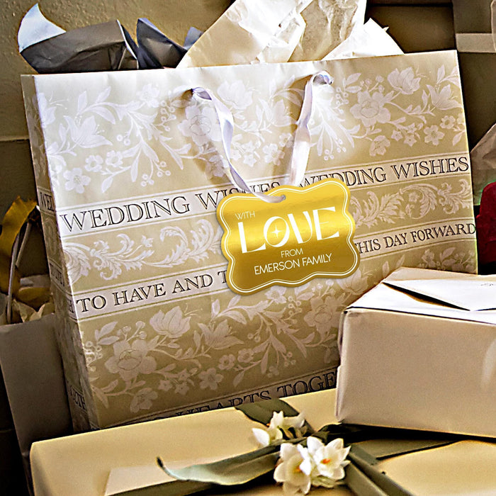 Wedding gift bags and favor boxes displayed with personalized “With Love” gold foil wedding gift tags. Styled for elegant wedding receptions, showers, and celebration tables.