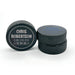 Two personalized hockey pucks showing the UV printed birth announcement design from the front and side.