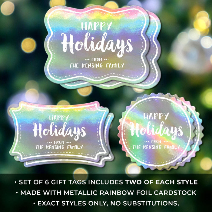 Set of 6 personalized Happy Holidays gift tags in three shapes displayed against a blurred Christmas tree with warm holiday lights.