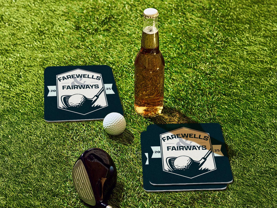 Custom square pulpboard coasters are shown sitting on a grassy, green golf course next to a bottle of beer, white golf ball, and golf club. The coaster features design with an illustration of a golf ball and with club behind it and custom text.