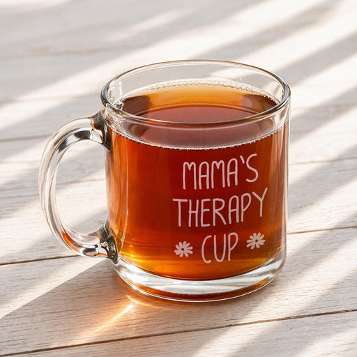 A glass mug filled with a warm beverage, placed on a wooden surface.