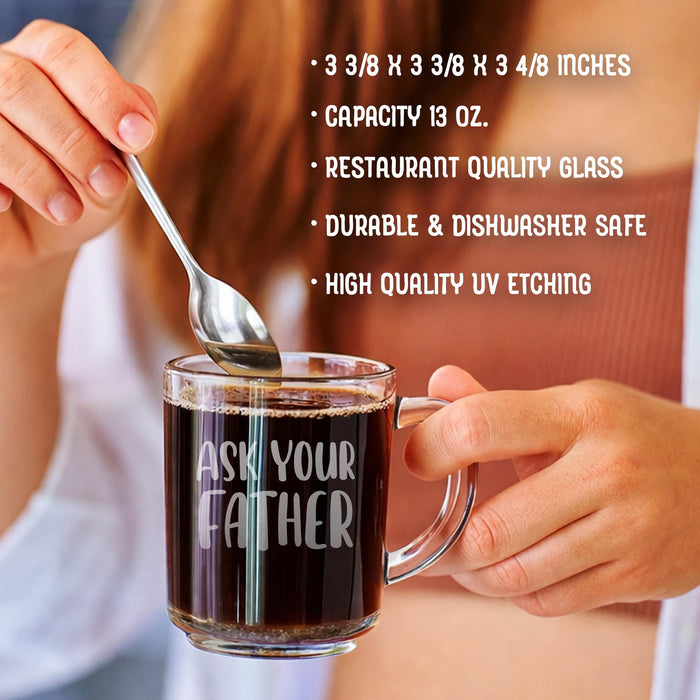 A person stirring coffee in the personalized glass mug with a spoon. This lifestyle image shows the mug in use and emphasizes its practical daily function.