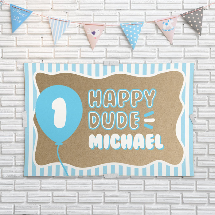 ONE Happy Dude birthday banner displayed as party wall décor with blue and pastel party decorations for a fun first birthday celebration.