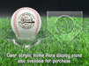 A personalized baseball with red stitching is placed on a clear acrylic stand, accompanied by a text overlay that reads Clear acrylic Home Plate display stand also available for purchase.
