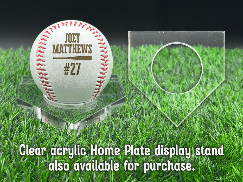 A baseball with the name "JOEY MATTHEWS #27" printed on it, placed on a clear acrylic display stand.