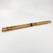 A pair of wooden drumsticks with the name "Alice Gallagher" and the words "Rock On!" engraved on them.