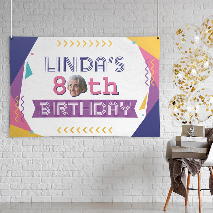 Retro 80s birthday banner displayed as wall décor featuring a custom name, age, and face cutout.