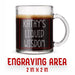 A glass mug with an engraved design on it. The mug is filled with tea, and there is text under the mug that reads "Engraving Area is 2 in x 2 in”