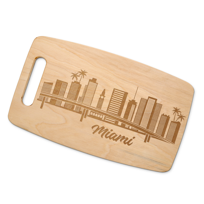 Miami skyline maple cutting board displayed on a white background.