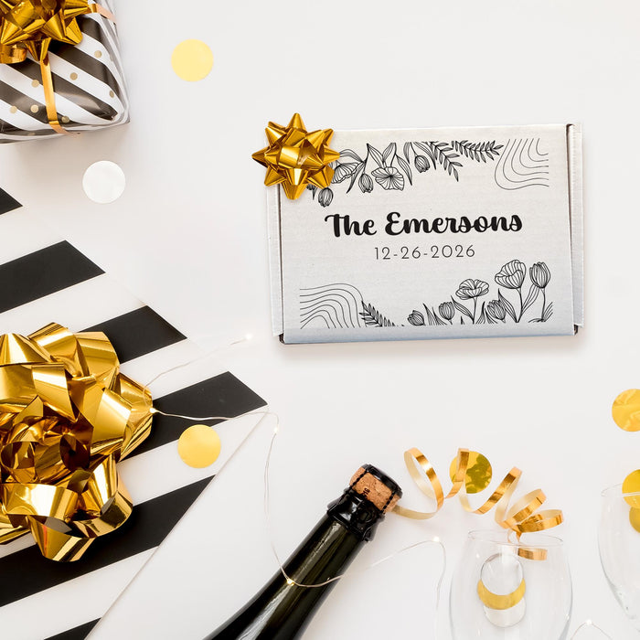 Wedding gift box displayed with champagne, confetti, and celebration décor. Features a personalized design with couple names and wedding date.
