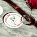 Personalized dirty martini coaster placed beside cocktail glasses on a marble bar surface, featuring the custom bar name, martini illustration, and established year.