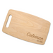 A natural maple cutting board with the name "Coleman EST. 2026" engraved on it.