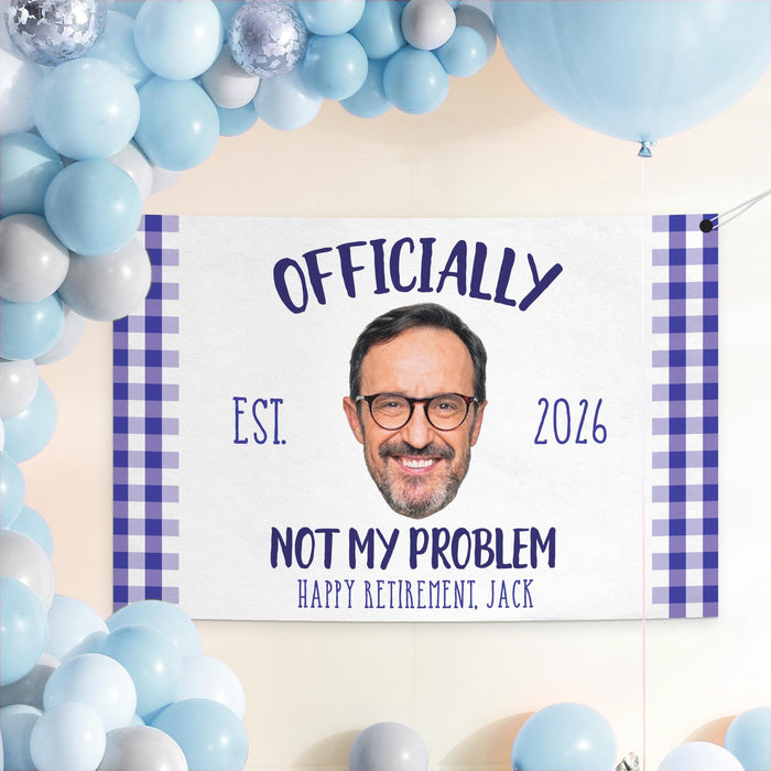 Officially Not My Problem retirement banner displayed as a party backdrop with blue balloons. Personalized retirement decoration featuring a custom photo and retirement year.