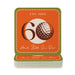 A stack of orange coasters with the number 60 and a golf ball graphic on them, along with the text "EST. 1965" and "And Still On Par" printed on them.