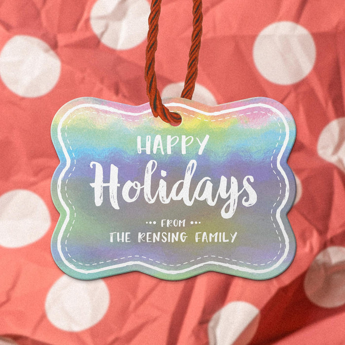 Personalized Happy Holidays rounded rectangle hang tag displayed against red and white polka dot holiday wrapping paper.
