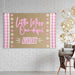 Styled display of the ONE-derful birthday banner showing the butcher paper texture, pink color palette, and playful first birthday theme.