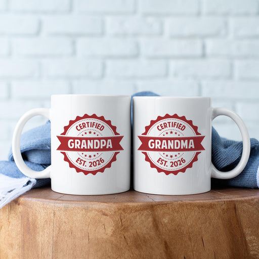 Personalized Grandma and Grandpa mugs with custom established year displayed together.