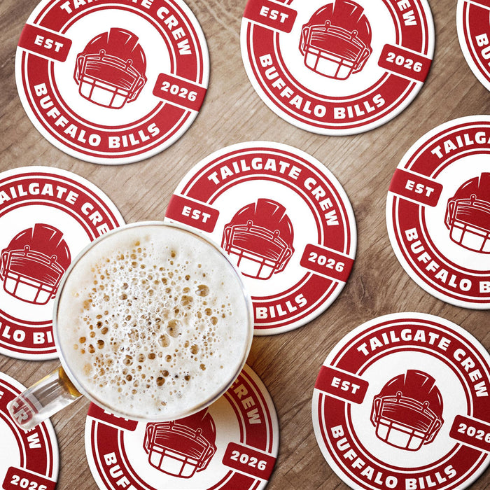 Red custom tailgate coasters arranged around a beer, featuring a football helmet, team name, and established year.
