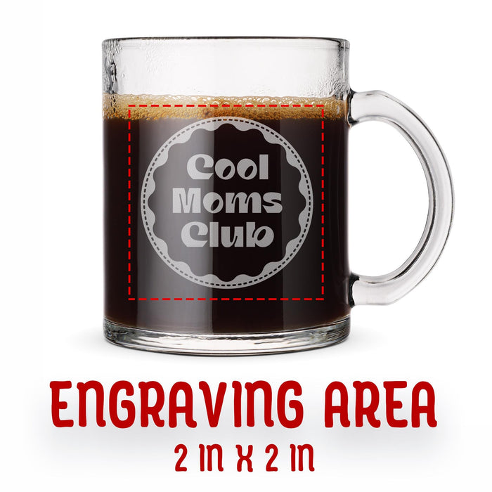 A glass mug with an engraved design on it. The mug is filled with tea, and there is text under the mug that reads "Engraving Area is 2 in x 2 in”