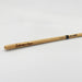 A wooden drumstick with the name Sabrina Hann engraved on it.