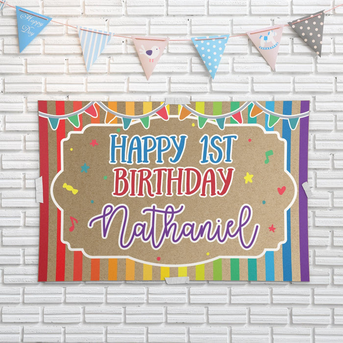 Rainbow birthday backdrop displayed against a white brick wall showing the printed butcher paper material and bright multicolor design.