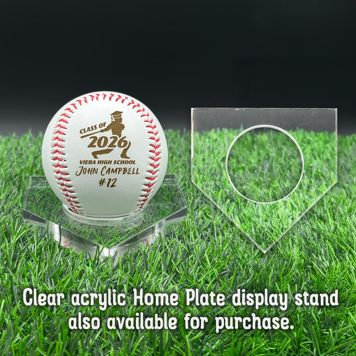 A personalized baseball with red stitching is placed on a clear acrylic stand, accompanied by a text overlay that reads Clear acrylic Home Plate display stand also available for purchase.