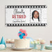 Retirement party display featuring the Officially Retired banner above a celebration table. Custom photo retirement sign shown as a backdrop for cakes, gifts, and party decorations.