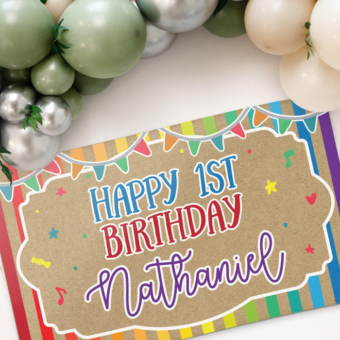 Angled view of the personalized birthday banner highlighting the rainbow striped border, colorful accents, and custom name personalization.