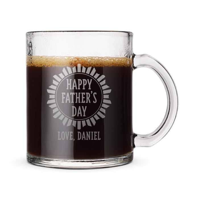 A glass mug filled with a dark liquid, likely coffee, with an engraved message that reads "Happy Father's Day Love, Daniel".