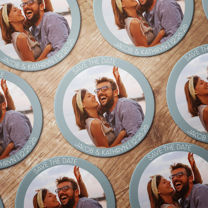 Personalized photo Save the Date coasters shown in multiple color options. Features a custom photo with names and wedding date.