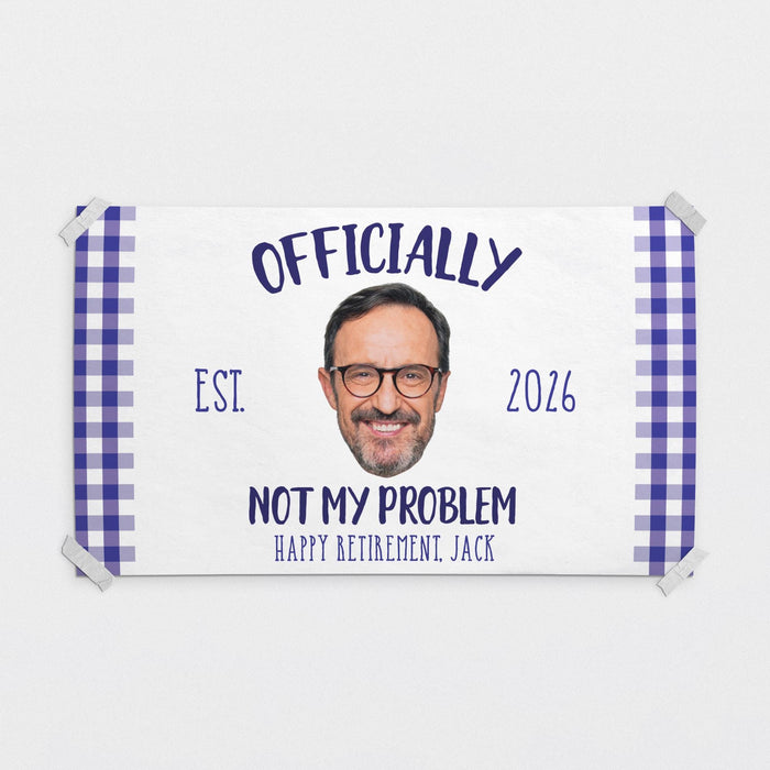 Personalized Officially Not My Problem retirement banner featuring a custom photo, retirement year, and retiree name. Fun retirement party decoration printed on white paper with a blue gingham border.