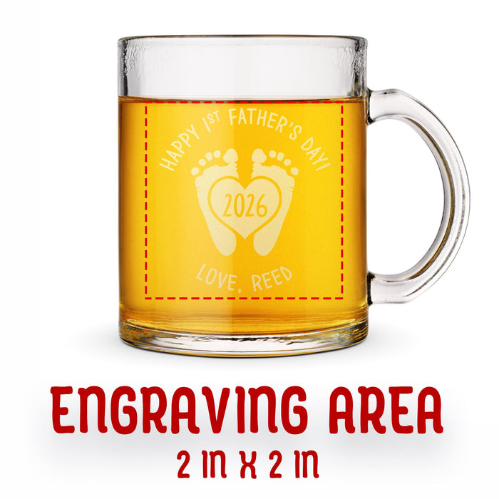 A glass mug with an engraved design on it. The mug is filled with tea, and there is text under the mug that reads "Engraving Area is 2 in x 2 in”