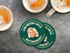 Custom round pulpboard coasters are shown sitting on a dark gray stone background with beer mugs surrounding them. The beer mugs have coasters underneath them. The custom coasters feature design printed with playful &quot;Swinging Into Retirement&quot; text, golf imagery, and custom photo.