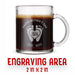 A glass mug with an engraved design on it. The mug is filled with tea, and there is text under the mug that reads "Engraving Area is 2 in x 2 in”