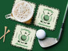 Custom square pulpboard coasters are shown sitting on a blue surface. Golf tees, a golf ball, and a golf club sit beside them. One coaster has a beer glass on top of it. The coaster features design with illustrated golf ball, club, and flag on top with wreath surrounding it, argyle background pattern, and custom text.