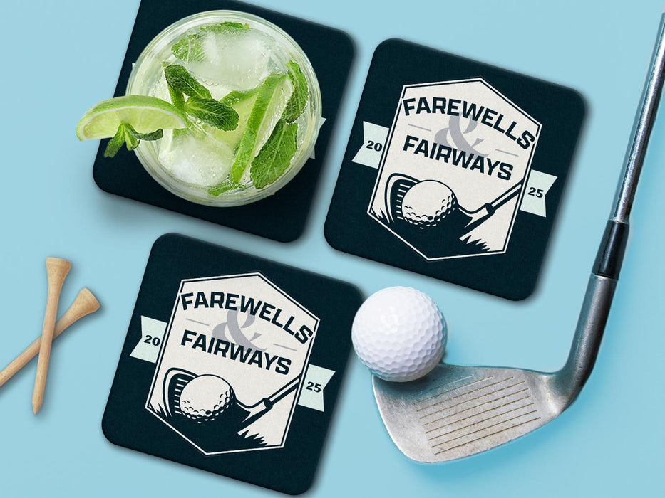 Custom square pulpboard coasters are shown sitting on a blue surface. Golf tees, a golf ball, and a golf club sit beside them. One coaster has a cocktail on top of it. The coaster features design with an illustration of a golf ball and with club behind it and custom text.