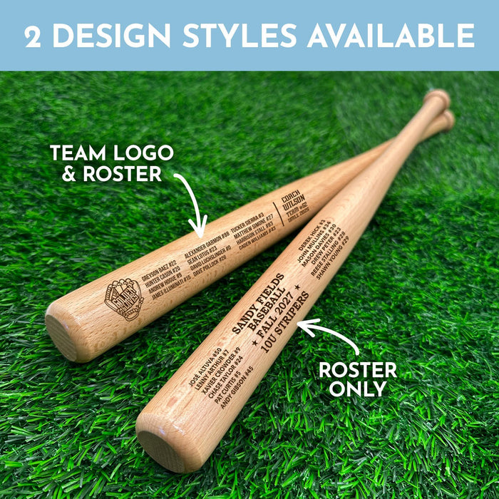Two personalized mini baseball bats with 2 different design styles engraved on them, placed on a green grass surface. The two designs styles shown are Roster Only and Team Logo & Roster.
