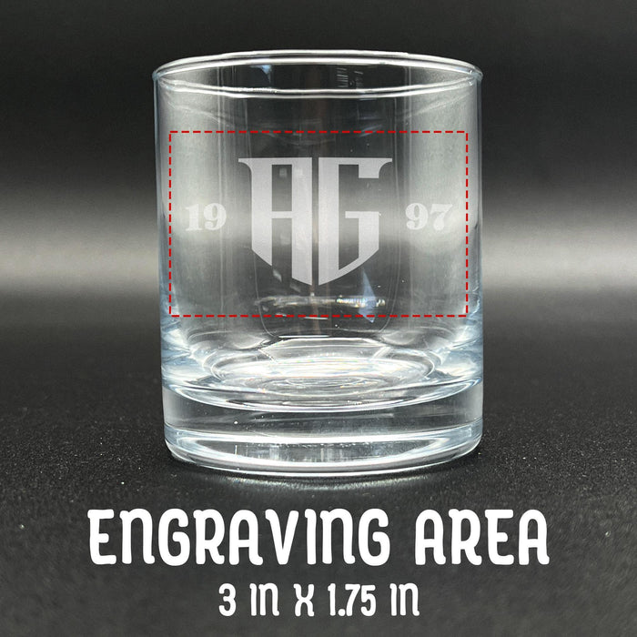 Close-up image of an empty whiskey glass showing the engraving placement area marked at 3 inches by 1.75 inches. Helps visualize design size and positioning.