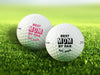 Two golf balls with Best Mom By Par designs printed on them, placed on a grassy field.