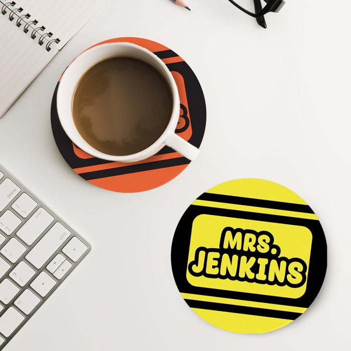 Personalized teacher coaster placed next to coffee and workspace items. Demonstrates practical everyday use.