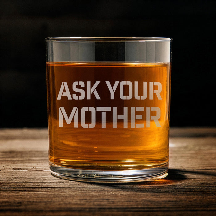 Front-facing product image of the whiskey glass on a wooden surface, clearly showing the “Ask Your Mother” design layout.