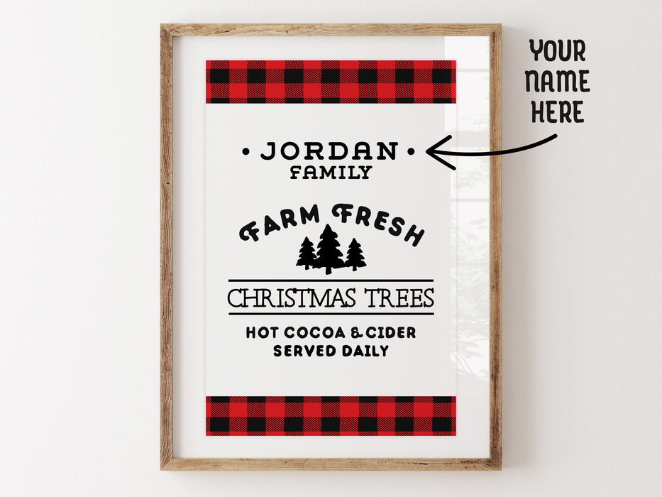 Your name here: Farm Fresh Christmas Trees design shown as digital download. Design has red and black plaid border with the black text, Jordan Family Farm Fresh Christmas Trees Hot Cocoa & Cider Served Daily. Design is shown in a white picture frame.