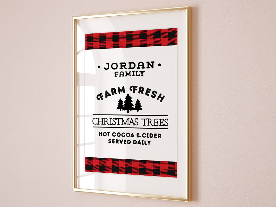 Farm Fresh Christmas Trees design shown as digital download. Design has red and black plaid border with the black text, Jordan Family Farm Fresh Christmas Trees Hot Cocoa & Cider Served Daily. Design is shown in a brown wooden picture frame.