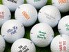 multiple titleist golf balls with different type, font, and colors on them on top of golf course grass