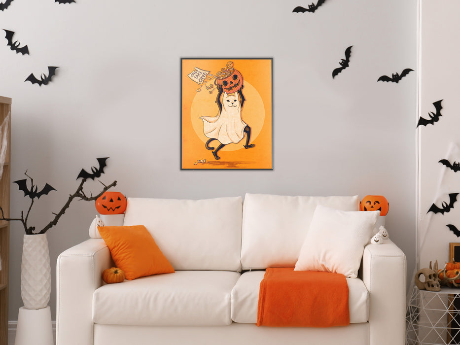 white wall with single frame of orange art of black cat dressed as a ghost running with a pumpkin bucket filled with candy with sign that says only take one, living room with couch with halloween decorations such as bats, pumpkins, orange pillows