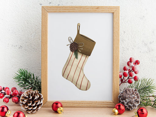 wooden frame hanging over wooden counter with christmas print of a rustic stocking surrounded by holiday decor such as white stars, mini wooden houses, and wrapped gifts