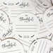 multiple paper coasters with the text "I'm Thankful for" printed on them.