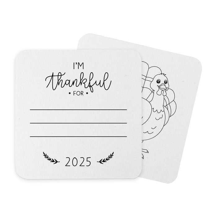 Front and back of coasters shown on a white background. Front of coasters show the text I'm thankful for, has lines for writing in a response, and current year. Back of coasters feature a turkey illustration.