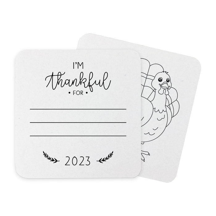 Front and back of coasters shown on a white background. Front of coasters show the text I'm thankful for, has lines for writing in a response, and current year. Back of coasters feature a turkey illustration.